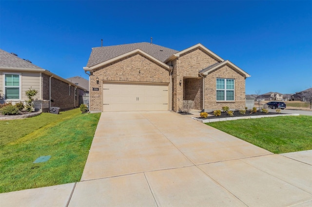 view of front of property featuring brick siding, concrete driveway, and a front yard