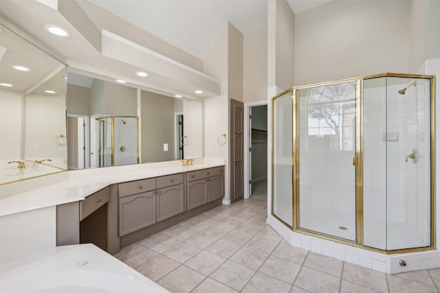 bathroom with a stall shower, lofted ceiling, tile patterned floors, vanity, and recessed lighting