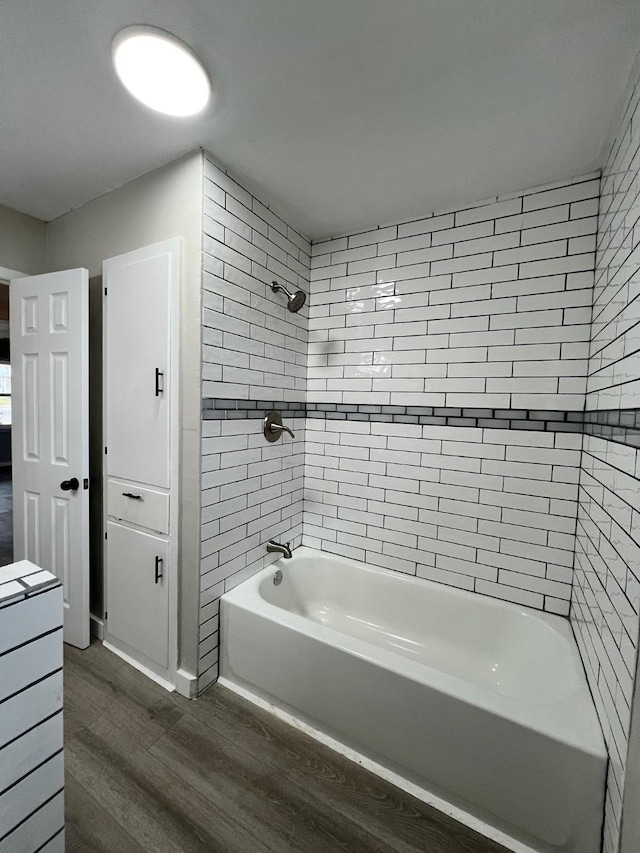 full bath with shower / tub combination and wood finished floors