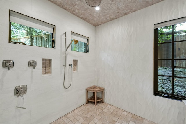 bathroom featuring a tile shower