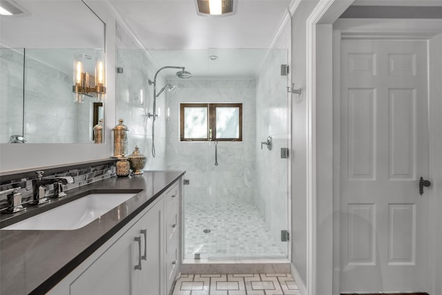 full bath featuring tasteful backsplash, a stall shower, and vanity