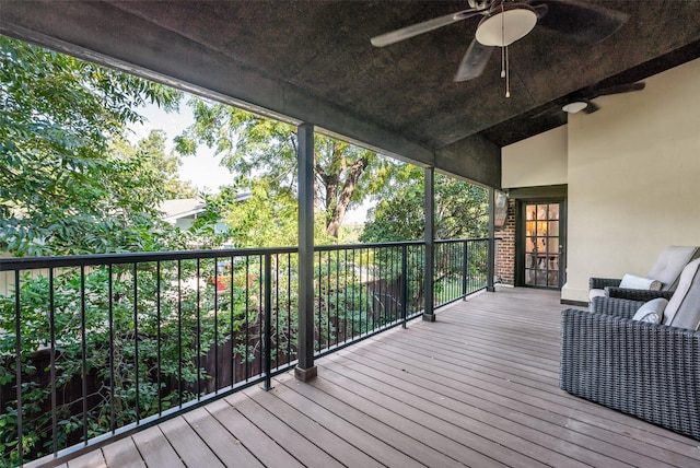 wooden terrace with a ceiling fan