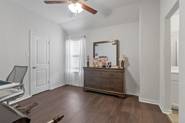 home office with dark wood-style floors, vaulted ceiling, baseboards, and ceiling fan