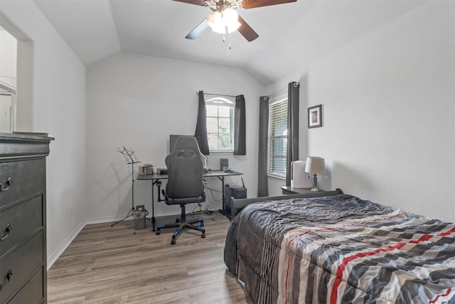 bedroom with lofted ceiling, baseboards, ceiling fan, and light wood finished floors