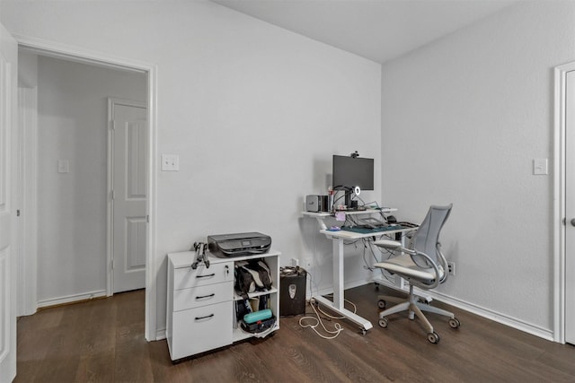 office space with wood finished floors and baseboards