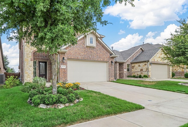 traditional home with driveway, brick siding, stone siding, an attached garage, and a front yard