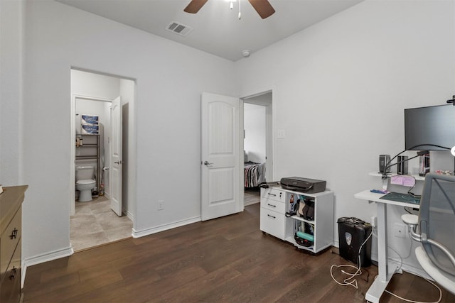 office with dark wood-style flooring, visible vents, ceiling fan, and baseboards