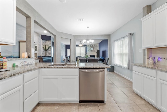 kitchen featuring a chandelier, a sink, visible vents, open floor plan, and dishwasher