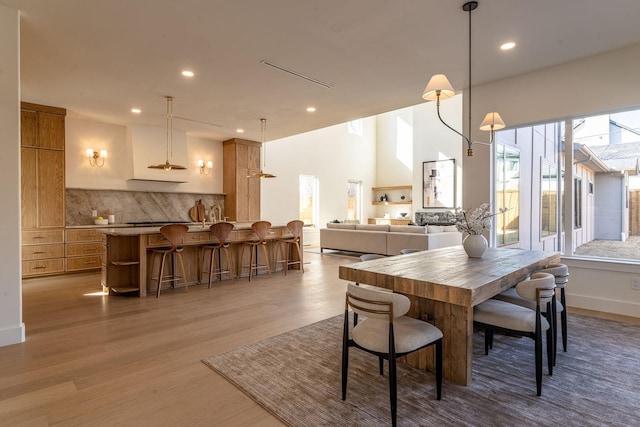 dining space featuring recessed lighting and light wood-type flooring