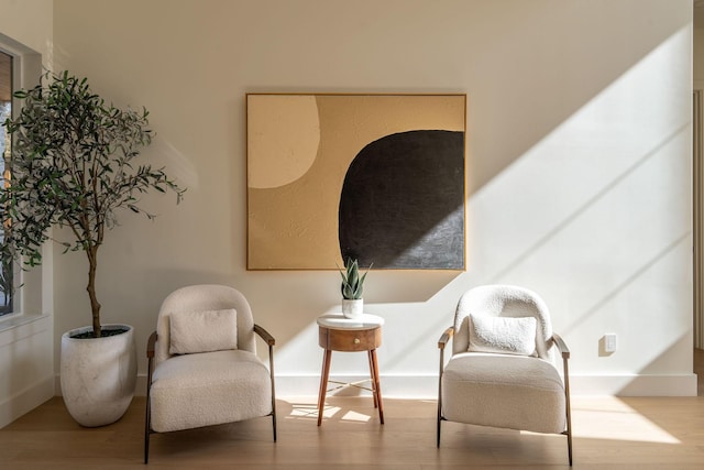 sitting room featuring wood finished floors and baseboards