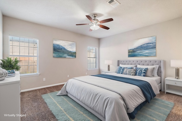 bedroom with carpet floors, baseboards, visible vents, and ceiling fan