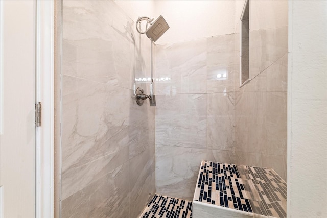 full bathroom with tiled shower