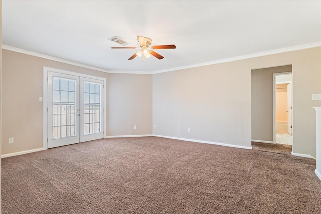 empty room featuring carpet flooring, visible vents, baseboards, ornamental molding, and french doors