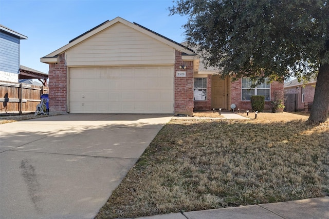 ranch-style house featuring concrete driveway, brick siding, an attached garage, and fence