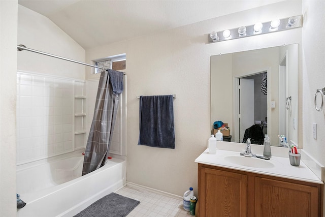 bathroom with shower / bath combination with curtain, vaulted ceiling, vanity, and baseboards