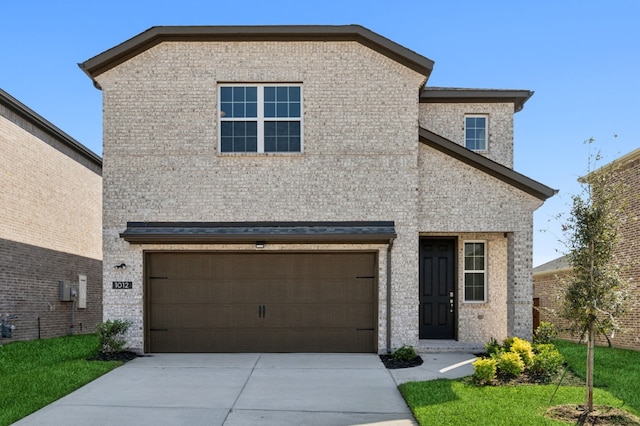 view of front facade featuring brick siding, driveway, and an attached garage