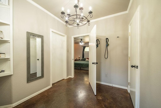 corridor featuring concrete flooring, baseboards, a chandelier, and crown molding