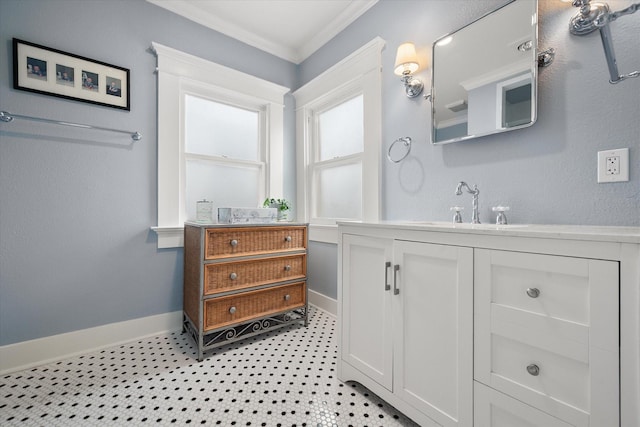 full bath featuring baseboards, ornamental molding, and vanity