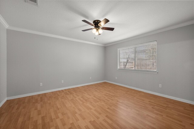 empty room featuring a ceiling fan, light wood-style flooring, and baseboards