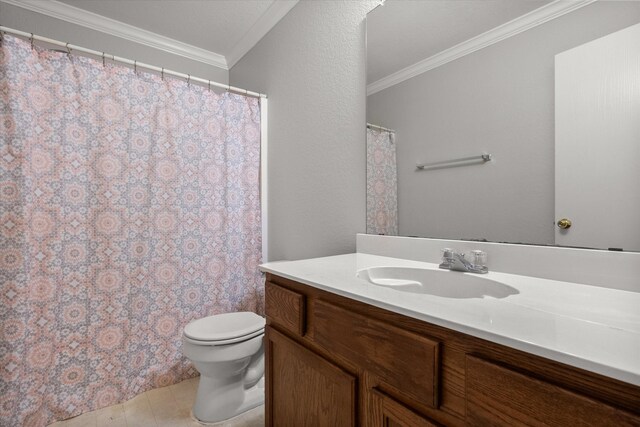 bathroom with toilet, vanity, visible vents, tile patterned floors, and crown molding