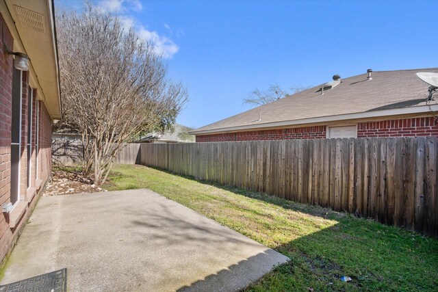 view of yard featuring a fenced backyard and a patio