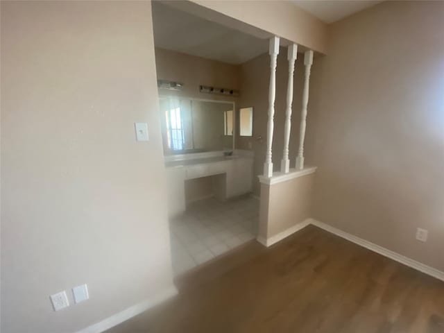 bathroom featuring baseboards and wood finished floors