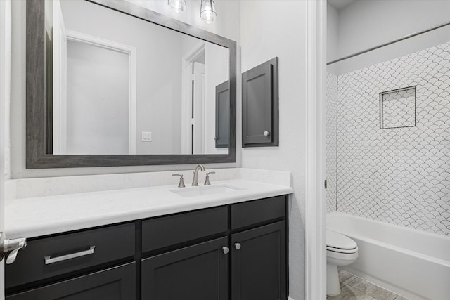 full bath featuring tub / shower combination, toilet, and vanity