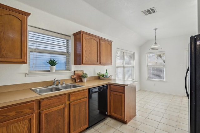 kitchen with visible vents, a peninsula, vaulted ceiling, black appliances, and a sink