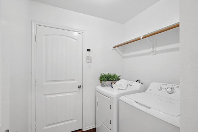 washroom featuring laundry area and washing machine and dryer