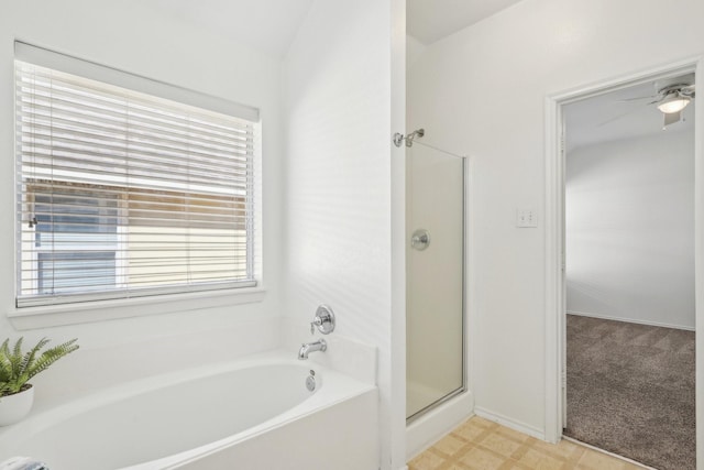 full bath featuring a garden tub, a shower stall, and tile patterned floors