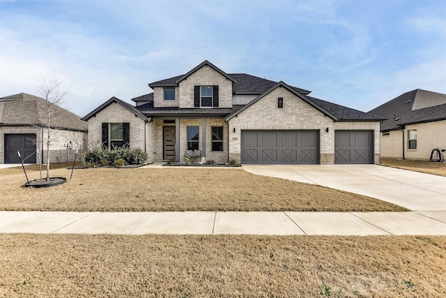 view of front of house featuring concrete driveway, brick siding, an attached garage, and roof with shingles