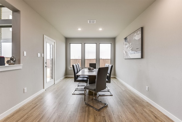 dining room featuring recessed lighting, visible vents, baseboards, and wood finished floors