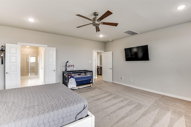 carpeted bedroom featuring connected bathroom, recessed lighting, a ceiling fan, visible vents, and baseboards