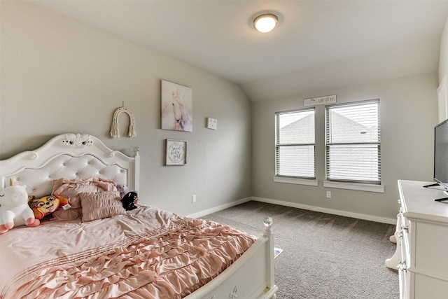 bedroom with lofted ceiling, baseboards, and light colored carpet