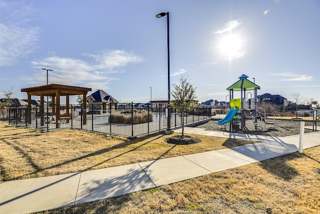 communal playground featuring fence