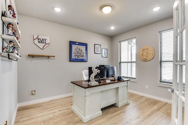 office space featuring light wood-style floors, recessed lighting, and baseboards