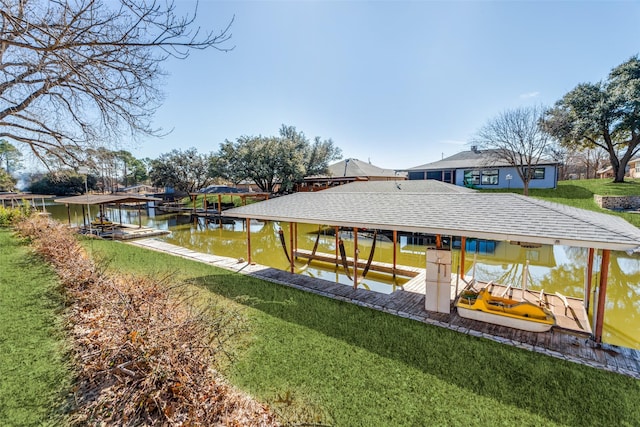 dock area featuring a water view and a yard