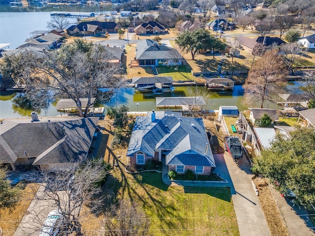 bird's eye view featuring a residential view and a water view