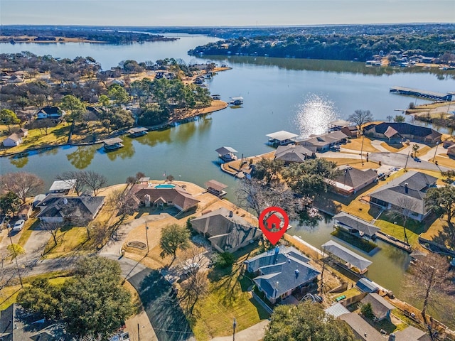 drone / aerial view with a residential view and a water view