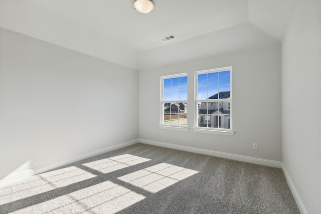 unfurnished room featuring carpet, visible vents, and baseboards