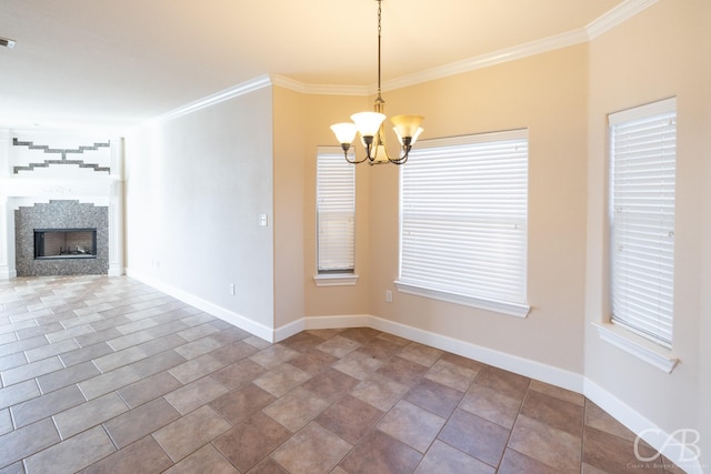 unfurnished dining area with baseboards, ornamental molding, tile patterned flooring, a fireplace, and a notable chandelier