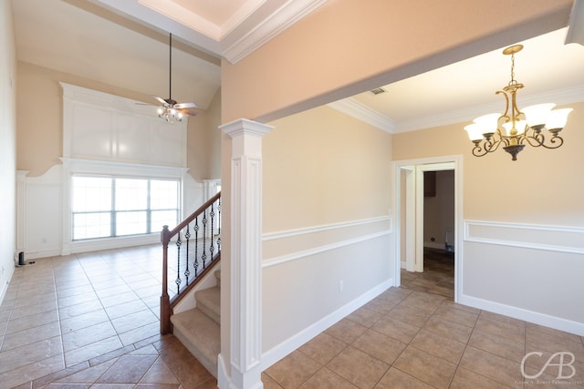 interior space with decorative columns, baseboards, stairs, crown molding, and a notable chandelier