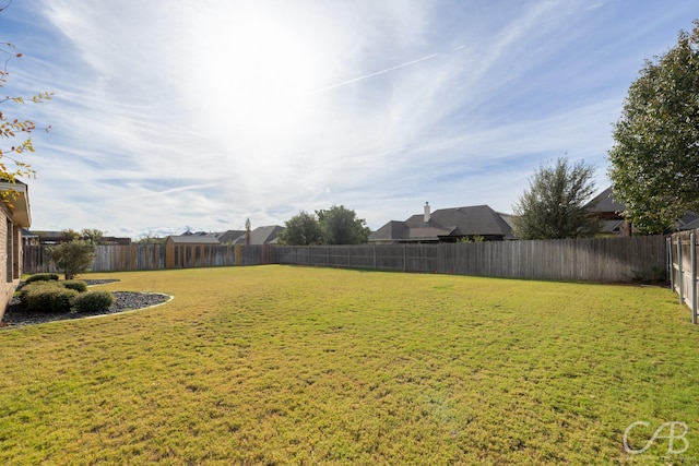 view of yard featuring a fenced backyard