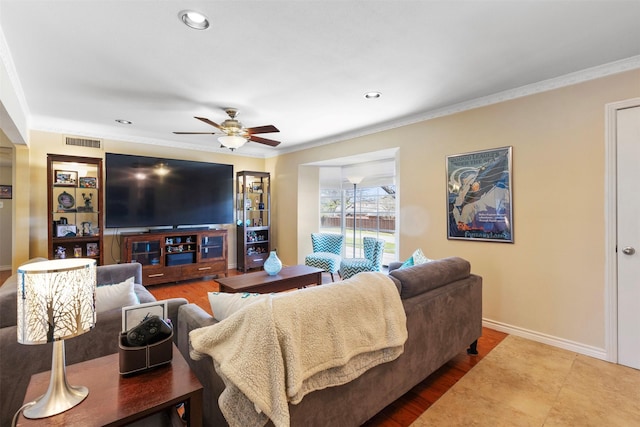 living area featuring ceiling fan, recessed lighting, visible vents, baseboards, and ornamental molding