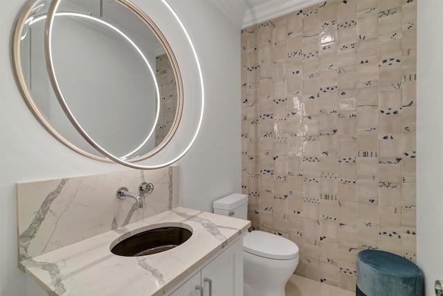 bathroom with toilet, backsplash, and vanity