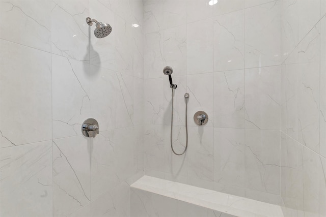 full bathroom with tiled shower