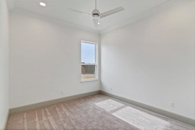 carpeted spare room featuring a ceiling fan, baseboards, crown molding, and recessed lighting