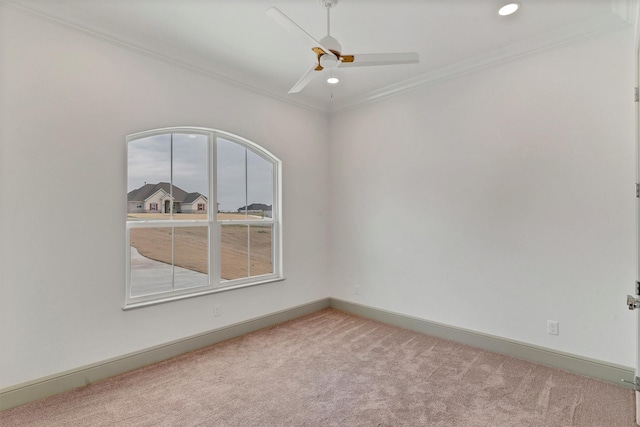 carpeted spare room featuring ornamental molding, recessed lighting, a ceiling fan, and baseboards