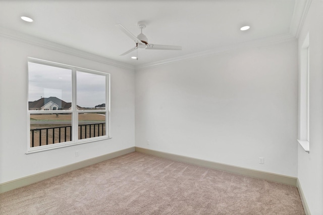 carpeted spare room featuring ceiling fan, baseboards, crown molding, and recessed lighting