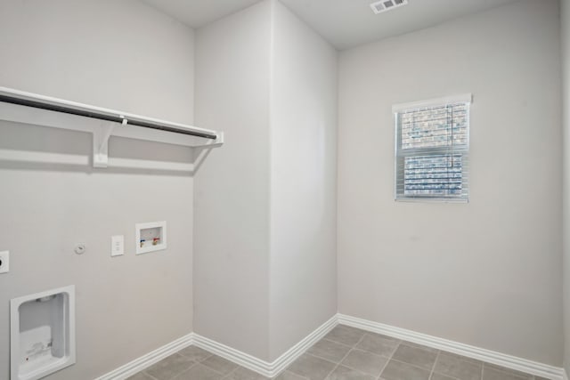 washroom featuring gas dryer hookup, laundry area, washer hookup, baseboards, and electric dryer hookup